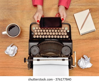 Female Author Are Holding The Phone In Hand