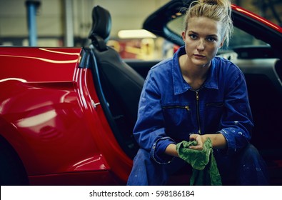 Female auto repair worker, having a break