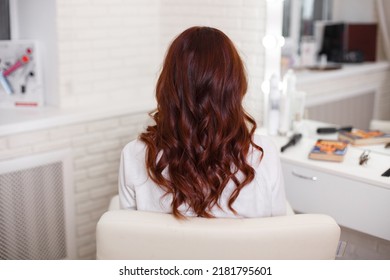 
Female Back With Long, Curly, Red Hair, In Hairdressing Salon
