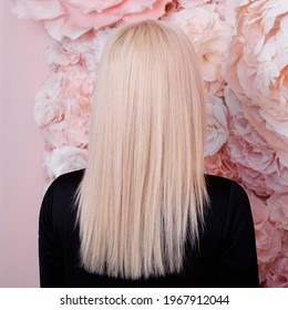 
Female Back With Long, Straight, Healthy, Blonde Hair, In Black Dress, On Flower Background