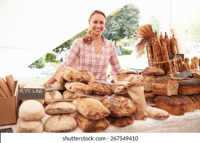 Female Bakery Stall Holder At Farmers Fresh Food Market - Powered by Shutterstock