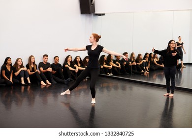 Female Ballet Student At Performing Arts School Performs For Class And Teacher In Dance Studio