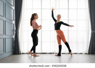 Female Ballet Teachers Training Ballerina To Have Right Postures In The Private Class At Home Studio. Choreographer Teaching Caucasian Dancers To Movements Of Modern Music. Concept Of Dance Rehearsal