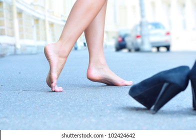 Female Bare Feet Dancing On Summer Street