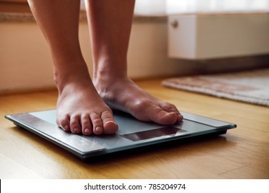 Female Bare Feet On The Digital Scale