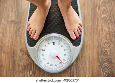 Female Bare Feet On Weight Scale, Top View