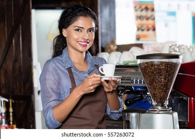 Female Barista Preparing Coffee In Indian Cafe