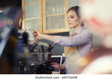 Female Barista Serving Coffee To Customer 