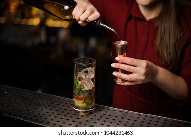 Female Bartender Filling A Liqour To The Measuring Pile For Preparing A Delicious Fresh Cocktail