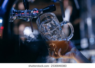 Female Bartender pouring beer at the bar. Close up hands	 - Powered by Shutterstock