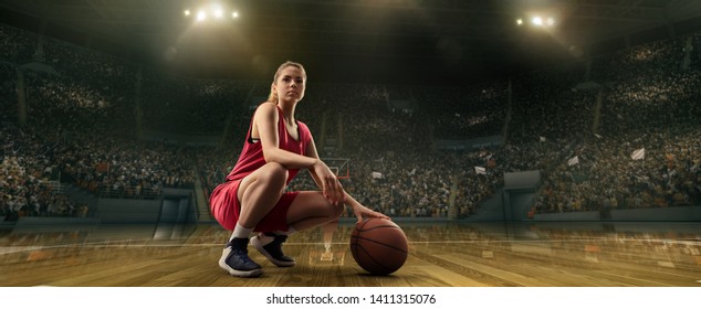 Female Basketball Player With Ball On Big Professional Arena 