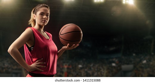 Female Basketball Player With Ball On Big Professional Arena 