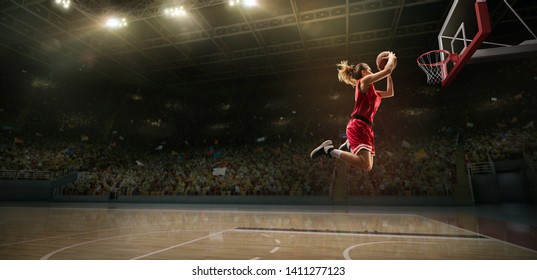 Female Basketball Player Makes Slam Dunk. Basketball Player On Big Professional Arena During The Game