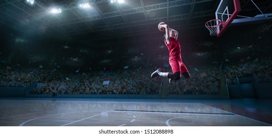 Female Basketball Player Makes Slam Dunk. Basketball Player On Big Professional Arena During The Game