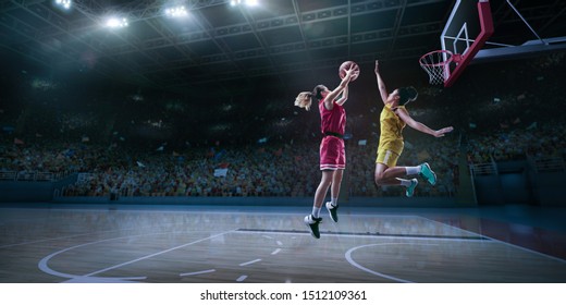 Female Basketball Player Makes Slam Dunk. Basketball Player On Big Professional Arena During The Game