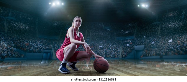 Female Basketball Player Sits With A Ball On Big Professional Arena