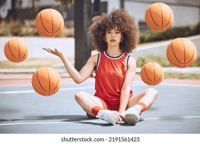 Female Basketball Player Sitting With Balls In The Air On A Court, Learning Fitness Training And Doing Sport Exercise And Workout Outside. Portrait Of A Black Woman Playing Game And Looking