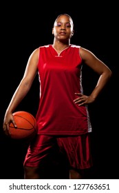 Female Basketball Player. Studio Shot Over Black.