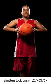 Female Basketball Player. Studio Shot Over Black.