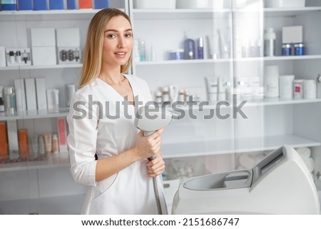 Female beautician using laser epilation machine in beauty salon ストックフォト © 