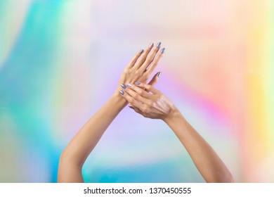 Female beautiful hands and glitter sparkly manicure isolated colorful gradient background  Beauty salon concept 