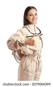 Female beekeeper showing thumb-up on white background