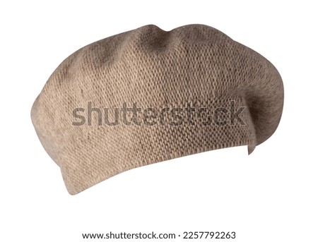 female beige knitted  beret isolated on white background. autumn accessory