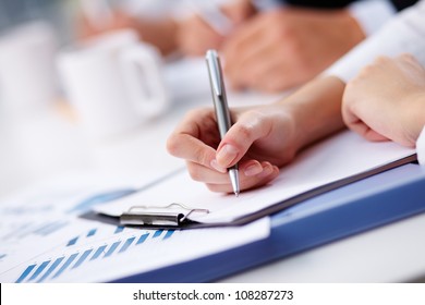 Female being ready to take notes at seminar - Powered by Shutterstock