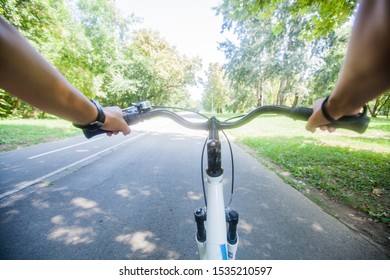 Female Biker Hands, View Of Bike Cyclist POV , Riding Outdoor 