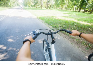 Female Biker Hands, View Of Bike Cyclist POV , Riding Outdoor 