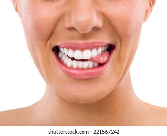 Female Biting Tongue With Perfect White Teeth