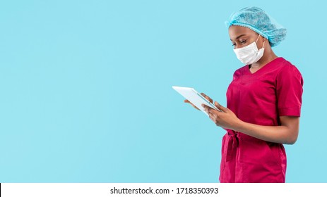 Female Black Doctor Working On Digital Tablet 