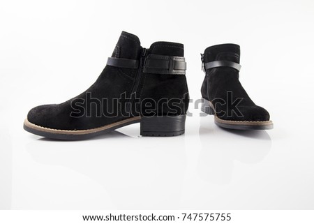 Female black leather boot on white background, isolated product, comfortable footwear.