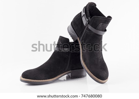 Female black leather boot on white background, isolated product, comfortable footwear.