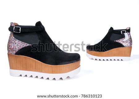 Female black leather boots on white background, isolated product, comfortable footwear.