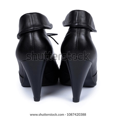 Female black leather high heel shoes isolated on white background.