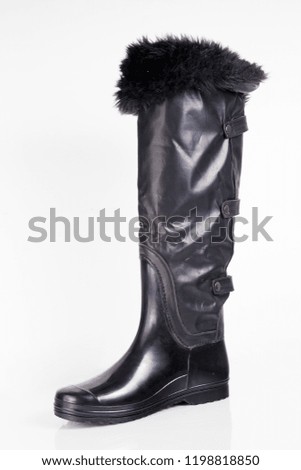 Female black rubber boot on white background, isolated product. 