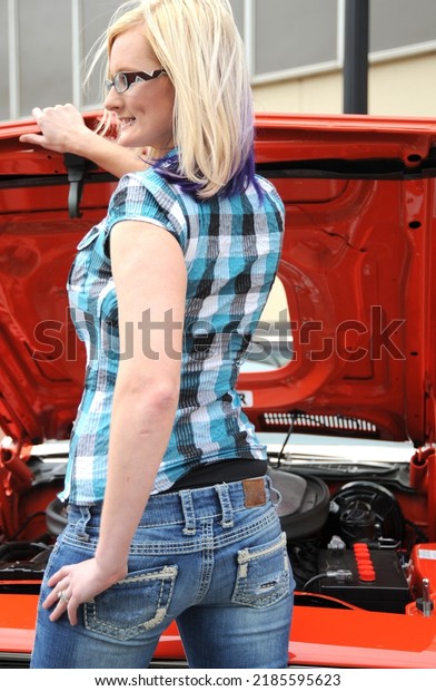 Female blond beauty\
with her car break down.