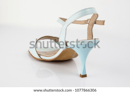 Female blue leather elegant sandal on white background, isolated product, comfortable footwear.