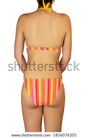 Female body back profile in bikini with pink and orange stripes on yellow against white background