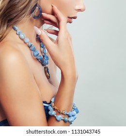 Female body with jewelry necklace, bracelet and earrings with blue gem - Shutterstock ID 1131043745