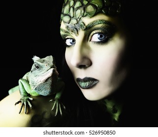 Female Body Painted Snake Goddess With Lizard Pet On Her Shoulder