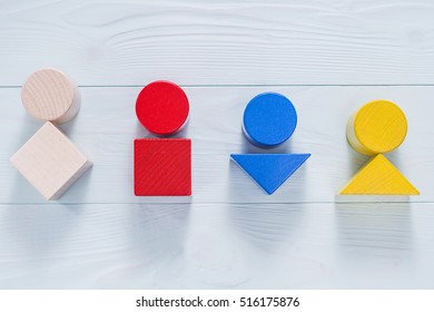 Female body shapes - four types, flat lay. Abstract female body types made from colorful wooden blocks.