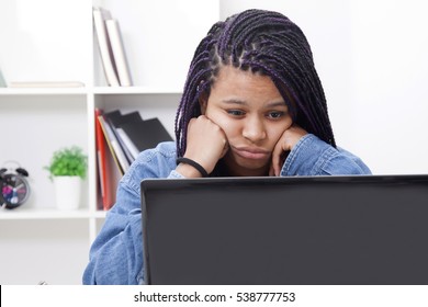 female bored and tired with the computer laptop