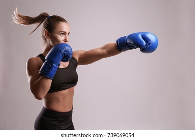 Female boxer on light background - Powered by Shutterstock