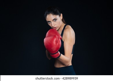 Female Boxer Posing On Black Background