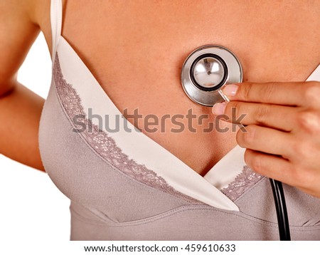 Female breasts close-up with stethoscope. Breast medical examination. Breast medical concept.