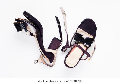 Female Broken High Heel Shoes On White Background