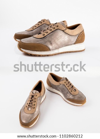 Female brown leather elegant shoe on white background. 