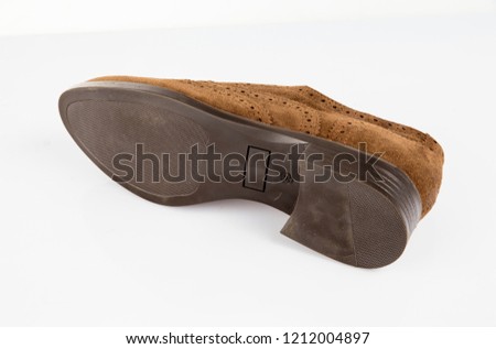 Female brown leather shoe on white background, isolated product, comfortable footwear.